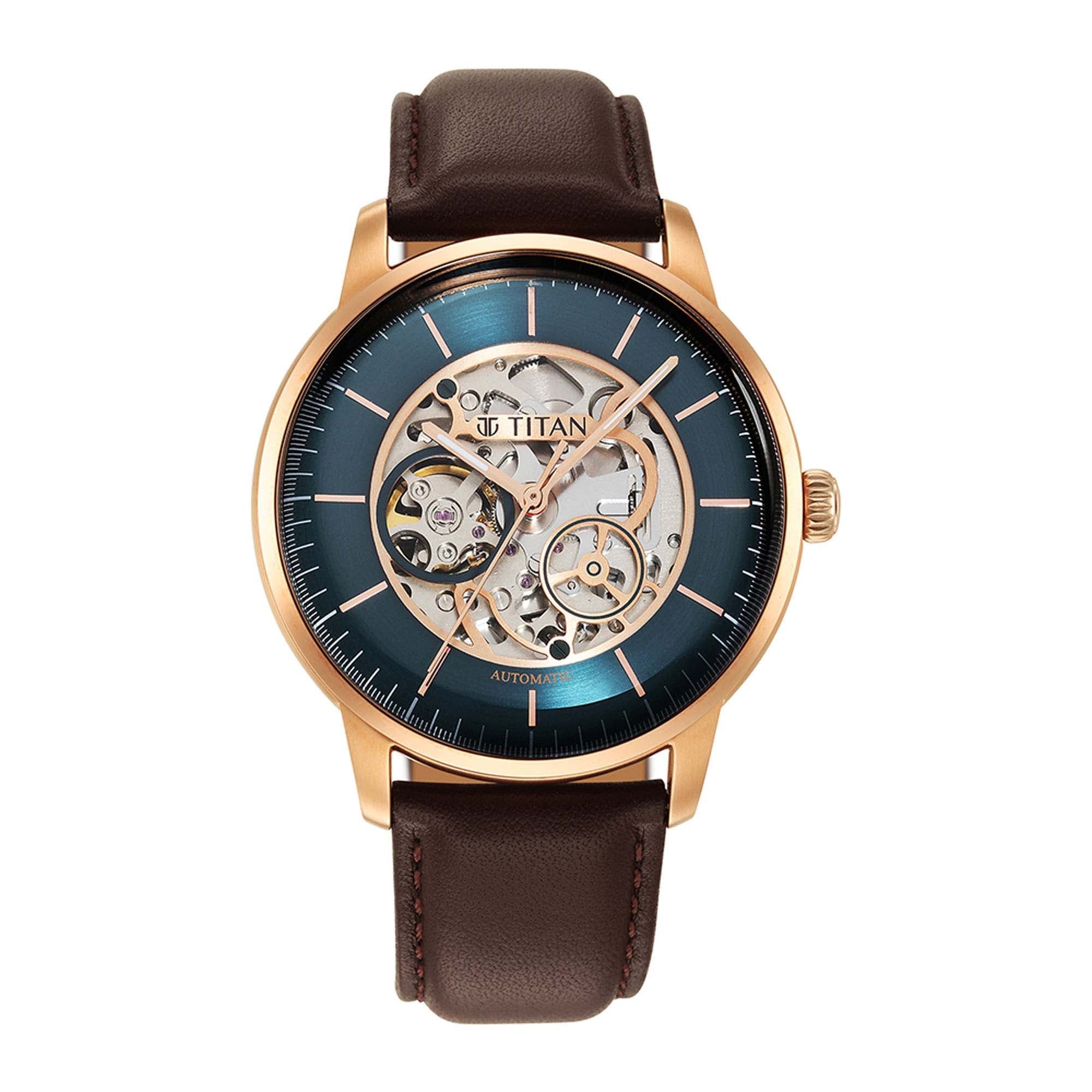 Elegant Titan automatic watch for men with green skeleton dial, rose goldcase & brown leather strap.