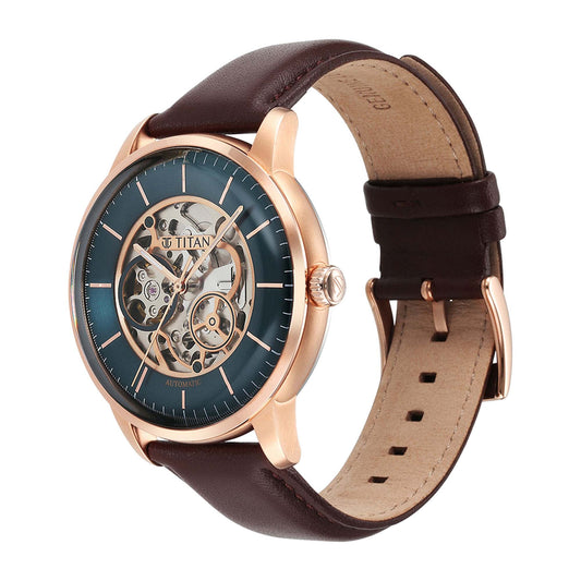Angled view of Titan automatic watch for men with green dial, rose gold case & brown leather strap.